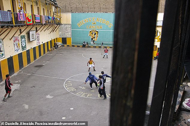 San Pedro Jail is significantly different from most correctional facilities.  Inmates buy or rent their accommodation and can play football (pictured) with their children