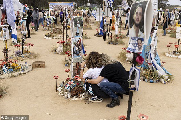 Mourners were photographed today visiting the site in Re'im, Israel, where revelers were kidnapped and killed in the Hamas terrorist attacks on the Nova music festival on October 7.