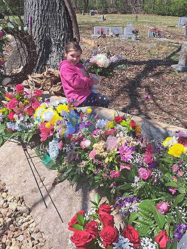 In one post, Emouree was seen at a cemetery while smiling with flowers around her.