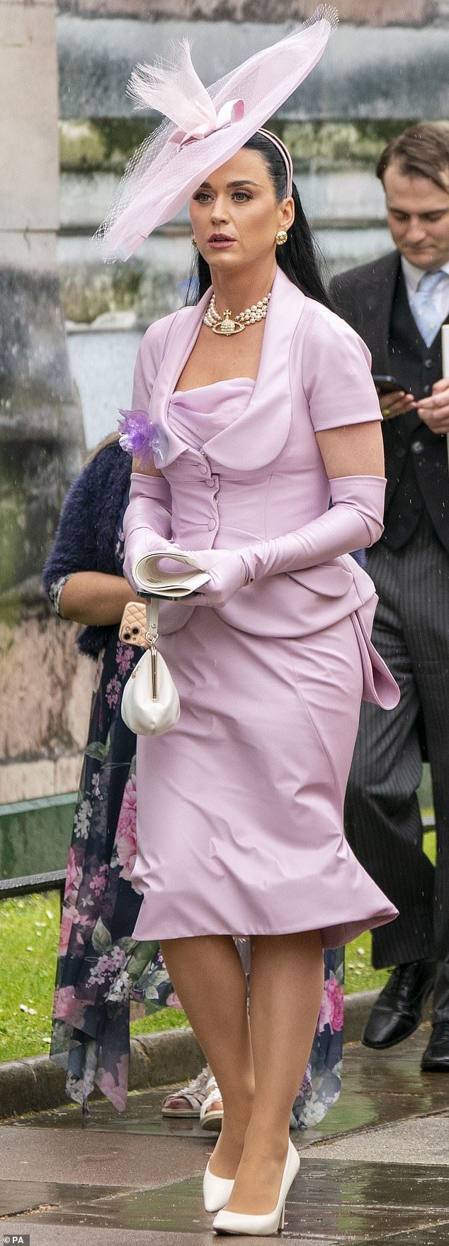 Katy Perry attends the coronation wearing custom Stephen Jones and Vivienne Westwood millinery