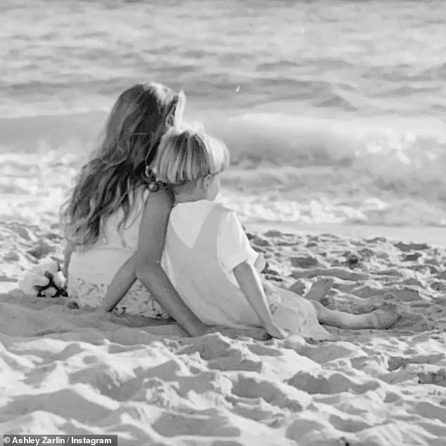 Another photo showed the sister and brother sitting on the sand while looking out at the ocean.