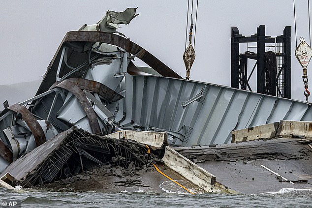 The Dalí crashed into the Francis Scott Key Bridge, causing it to fall;  Pictured: The twisted metal of the fallen bridge.