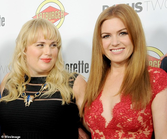 The announcement came after Rebel Wilson made shocking claims about her experience with 'douchebag' comedian Sacha in her new memoir, Rebel Rising (Rebel, left, pictured with Isla at the Los Angeles premiere of her film Bachelorette in 2012) .