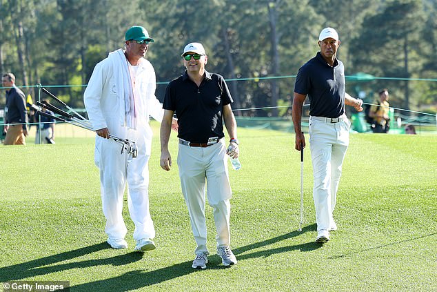 Woods was accompanied by caddy Lance Bennett (left) and business partner Rob McNamara.