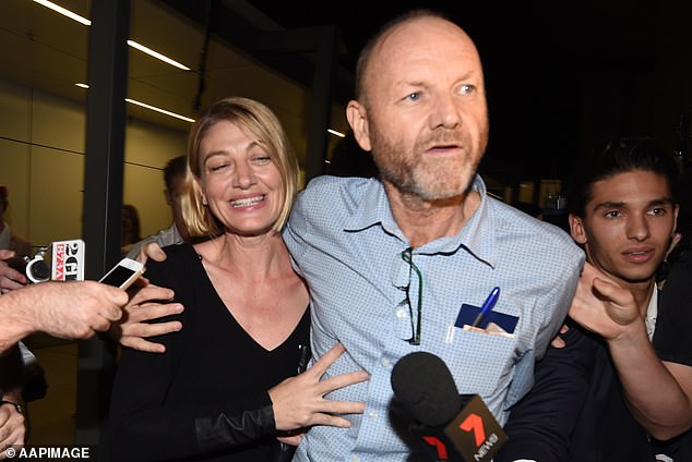 Brown and 60 Minutes producer Stephen Rice are pictured arriving home at Sydney Airport after spending two weeks behind bars on child abduction charges.