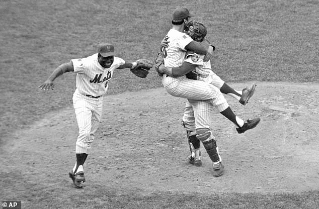 Grote, right, hugs pitcher Jerry Koosman as Ed Charles after the Mets won the 1969 World Series.