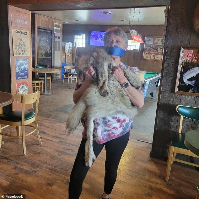 Jeanne Ivie-Roberts, a close relative of Roberts who lives in Daniel, recreated the bizarre scene wearing a wolf skin in the same bar, even covering her mouth with duct tape.