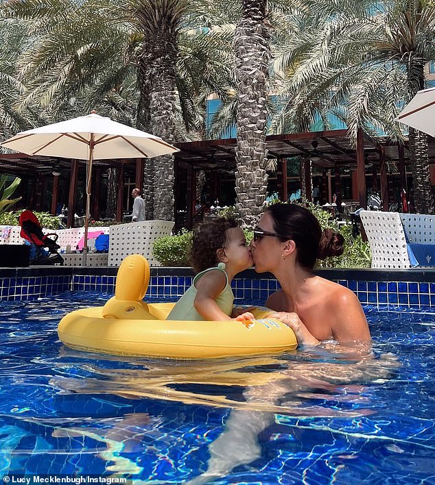 Lucy, who was staying at the incredible Rixos The Palm Dubai, also cooled off in the water and was seen kissing her little one as she floated in an inflatable baby chair.