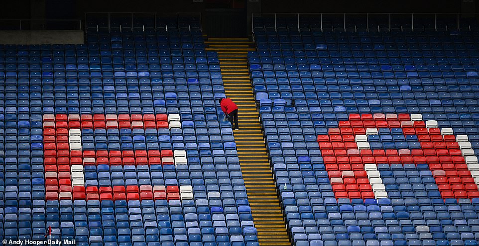 A steward cleaned the seats at Selhurst Park in the calm before the storm, and Manchester City later beat Crystal Palace.