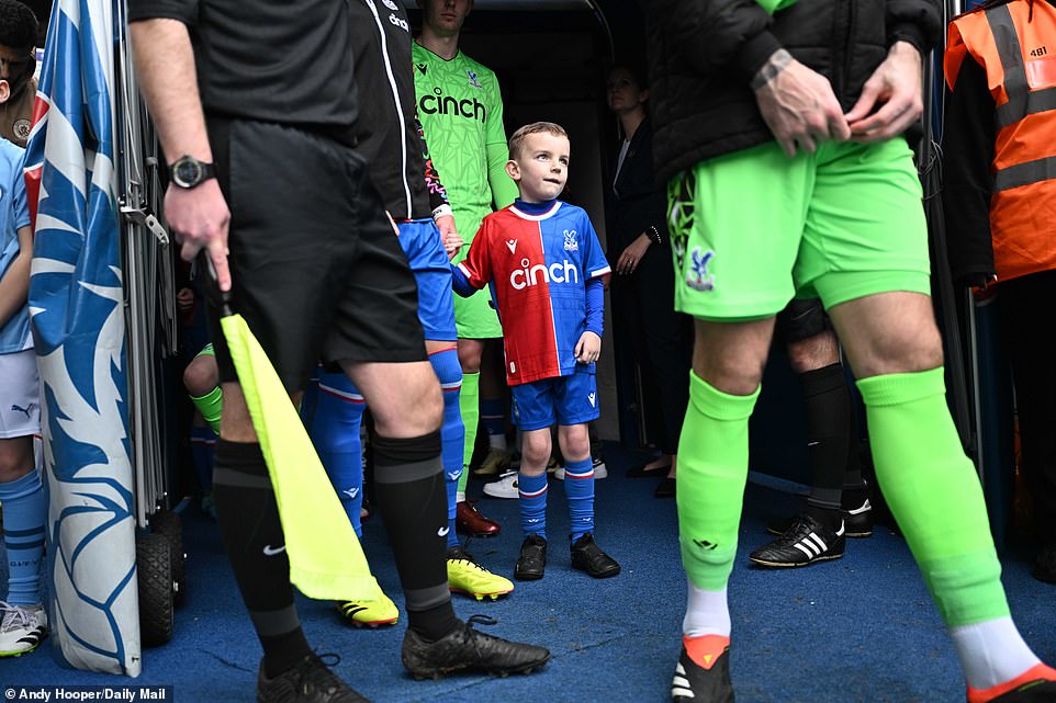 A young mascot took Palace captain Joel Ward by the hand before emerging from the tunnel alongside both teams.