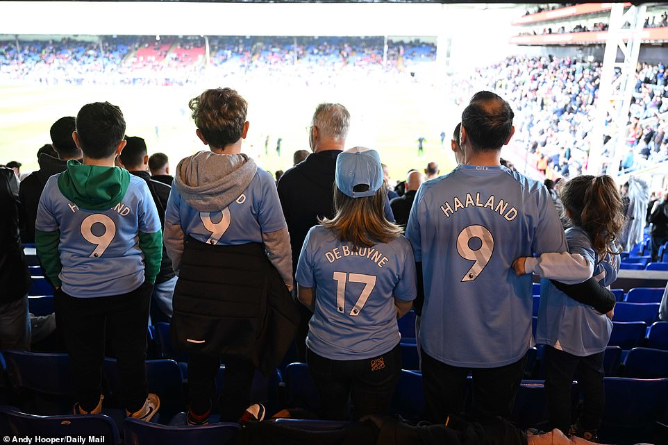 A family of five took their seats in City's away field, each sporting their own personalized City shirt.