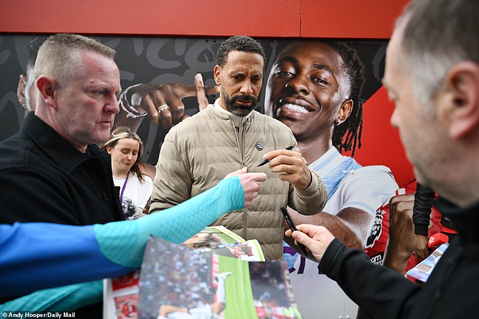 Manchester United and England legend Rio Ferdinand, now a pundit, signed autographs before beginning his broadcast duties.