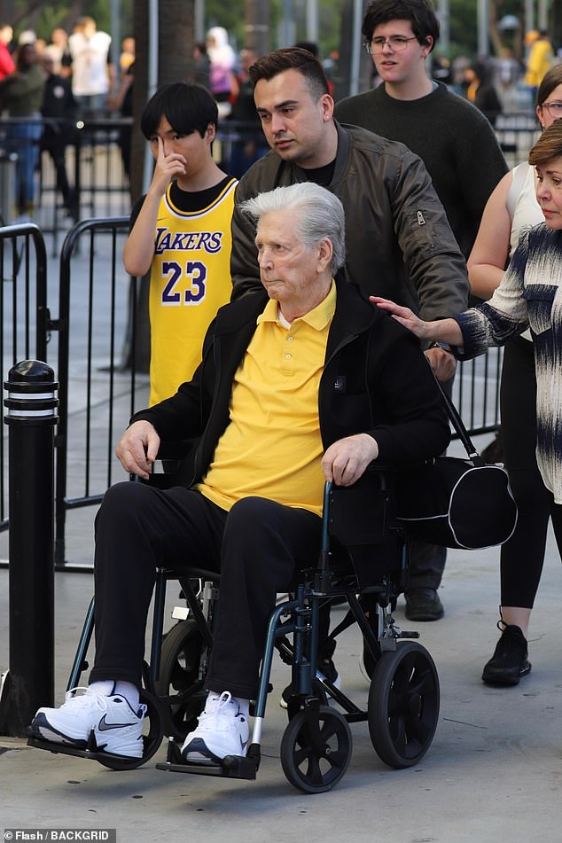Wilson, 81, appeared reserved as he was pushed in his wheelchair as he arrived at the Crypto.com Arena in Los Angeles to watch the Lakers' game against the Minnesota Timberwolves.