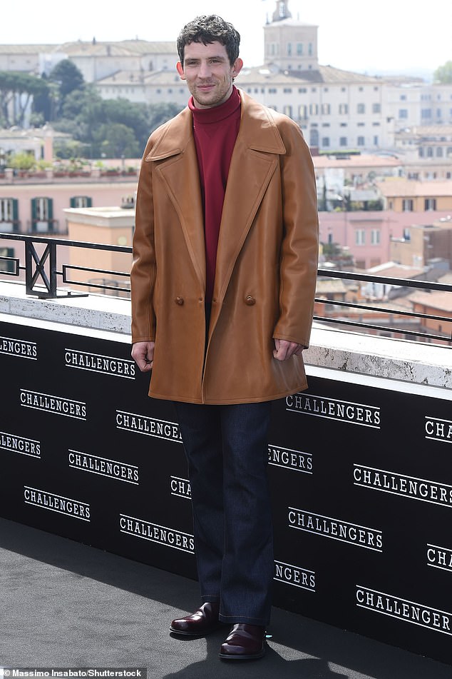 Josh looked dapper as he later donned a camel coat for the photos.