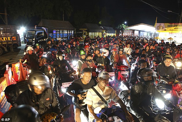 The Southeast Asian nation's roads and airports are expected to be packed with millions of people, with Muslims marking the end of the Islamic holy month on Tuesday night (pictured is the port of Gilimanuk on the island of Bali ).