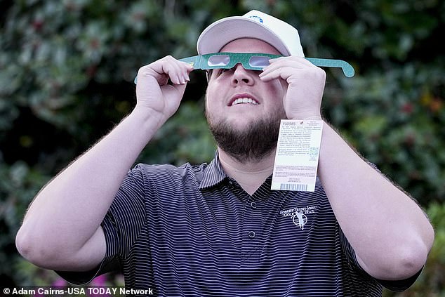 Tournament organizers instructed attendees to protect their eyes during Monday's eclipse.