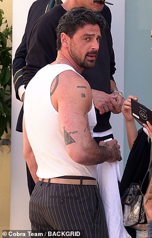 Italian actor Michele Morrone showed off his muscular and tattooed body in a tank top