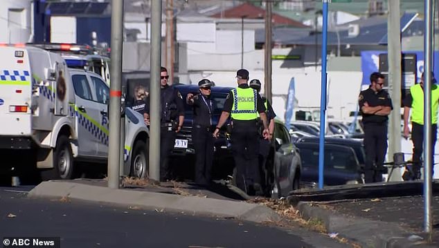 Tasmania Police have not confirmed whether the driver believed to have hit Marshall as he was leaving school for the day is a student, teacher or parent (pictured, officers at the scene)