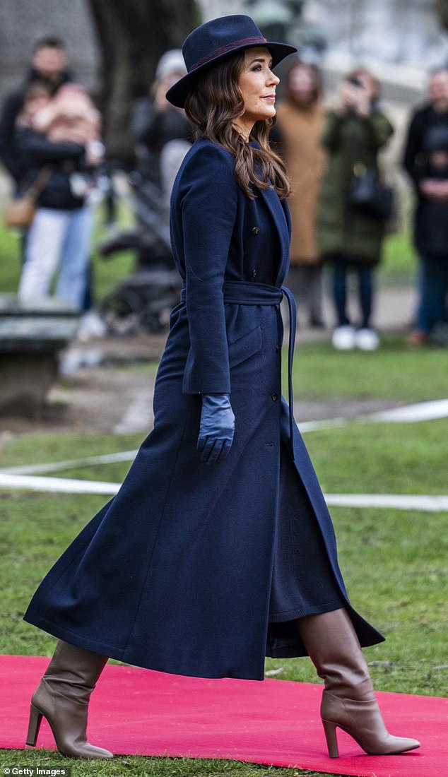 The newly appointed Queen paired her outfit with a trendy wide-brimmed hat and blue leather gloves.