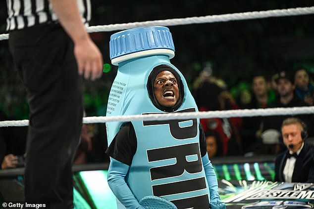 He accompanied Paul to the ring dressed as a bottle of the social media star's drinks brand.