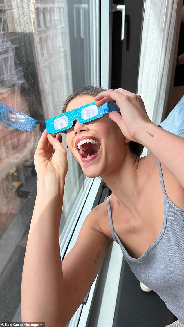 Kaia later posted a photo of herself at home swinging the glasses while watching the eclipse.