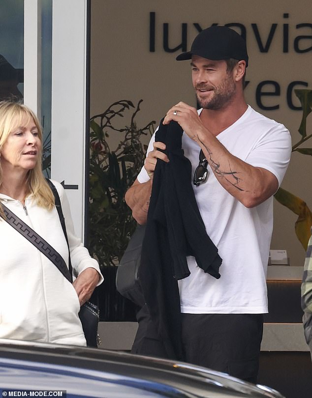 Hemsworth showed off the new ink that features a striking display of abstract lines along his left forearm in a plain white T-shirt.