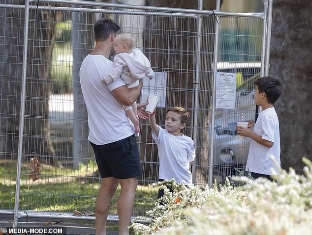 The AFL star, 40, was spotted on a family outing with his one-year-old daughter Paloma and two sons Henley, four, and Aston, seven.