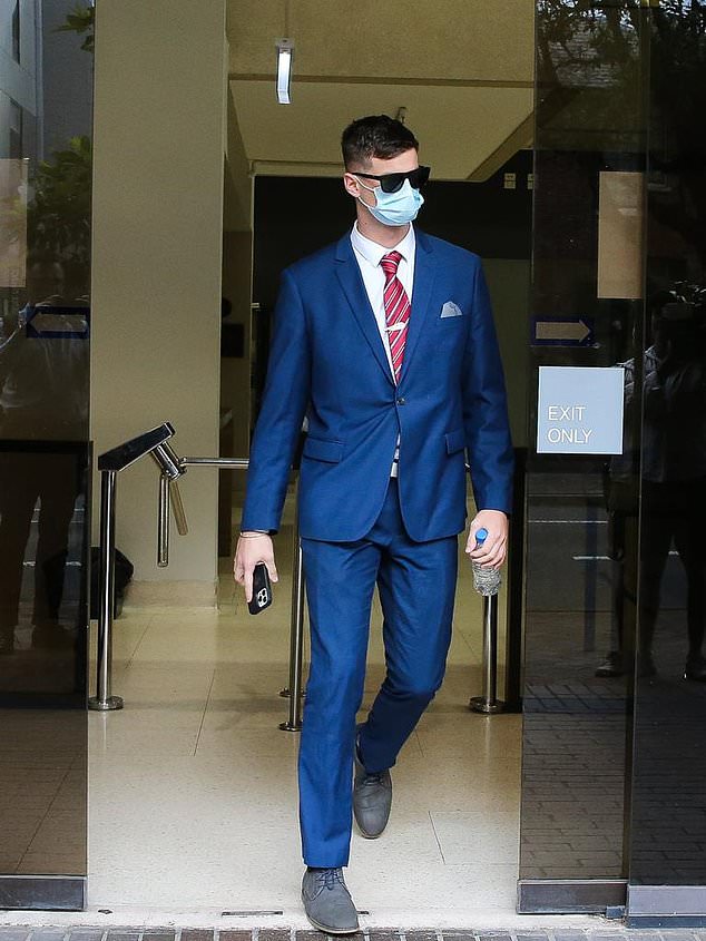 Dominik Sieben (pictured outside court) told police he was drinking a beer and trying to cheer on his team when he allegedly performed the salute.