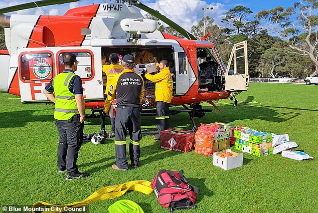 The Rural Fire Service has airdropped essential supplies (pictured) to residents of the Megalong Valley in the Blue Mountains who were left isolated after the only road out of the town was damaged.