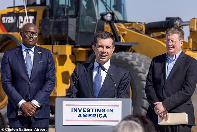 Malinowski is seen here on the right with Pete Buttigieg, the Secretary of Transportation, during a visit to Clinton National Airport last March.