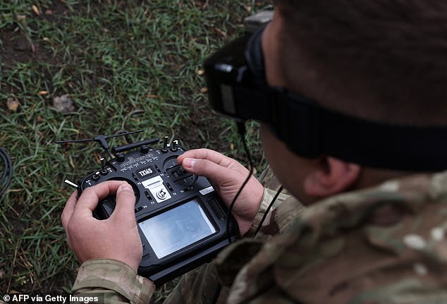 A Ukrainian FPV (first person view) drone operator trains not far from the front line in the Donetsk region on November 16, 2023.