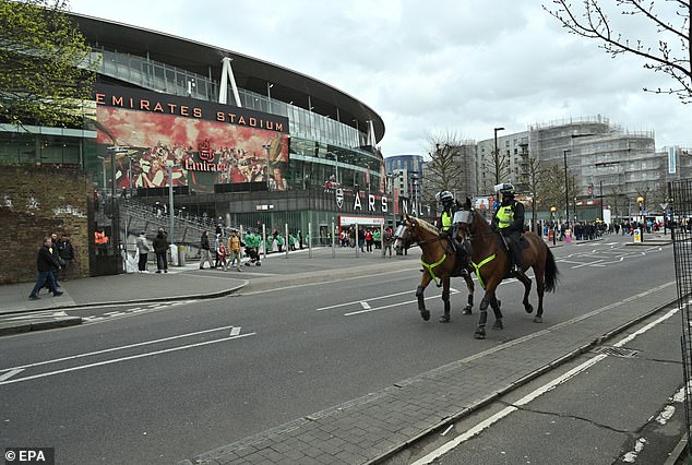 ISIS reportedly threatened to launch an attack on the four stadiums that will host the first leg of the Champions League quarter-finals, including the Emirates. Pictured is a file photograph of police outside the field.