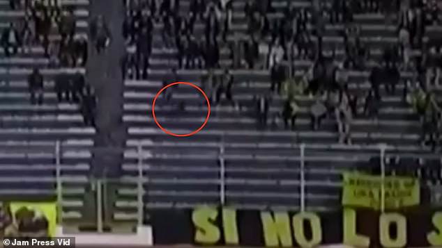 CCTV footage shows a dark figure moving quickly around the bend of the stadium, but match-goers were apparently unaware of the specter's presence.