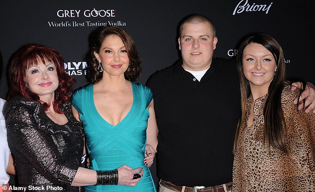 Kelley appears here on March 18, 2013 with her grandmother Naomi Judd, her aunt Ashley Judd, and her brother Elijah.