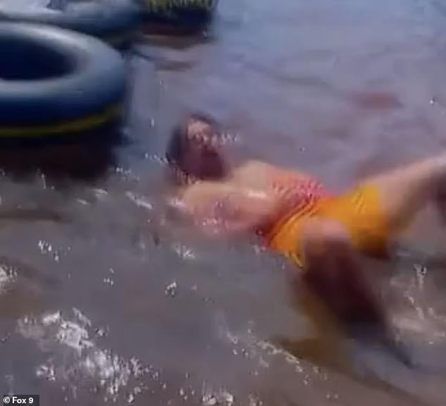 Video of the chilling moment showed a member of the group stumbling towards the river as a pool of red water emerged around them.