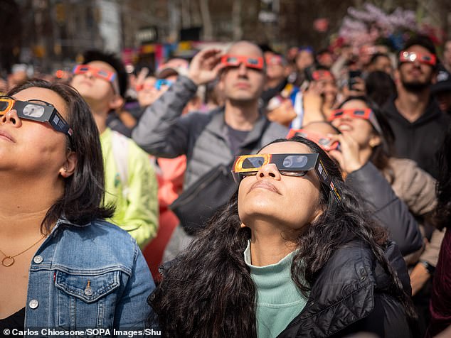 Eclipse watchers were asked to wear special glasses approved by the International Organization for Standardization (ISO), which are about 100 times darker than regular sunglasses.