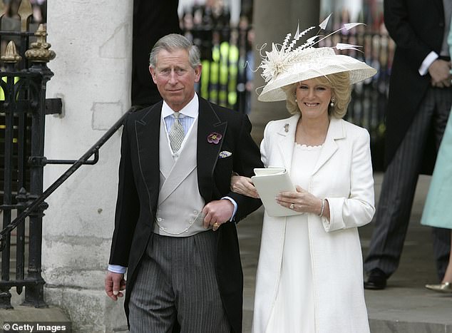 King Charles and Queen Camilla smile for the crowd moments after legally marrying in 2005.