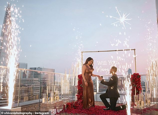 The couple's stunning proposal scene took place on a London rooftop with a rose, sparklers and an LED sign that read: 