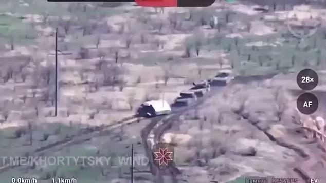 Another video, this time apparently taken from a drone, shows three Russian tanks with their covers lumbering across a battlefield in the Ukrainian-controlled city of Krasnohorivka while coming under fire.