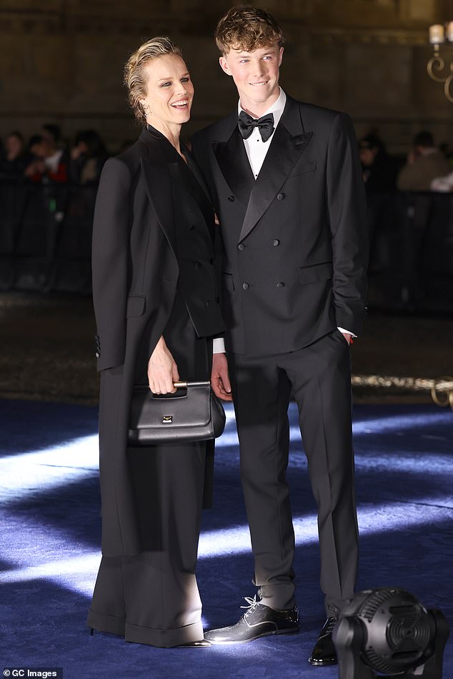 George (right), 16, donned a tuxedo and joined Eva Herzigova (left), 51, at an event in Milan.