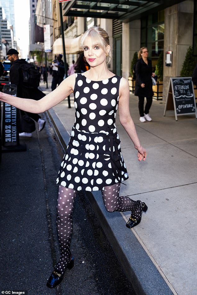 While promoting the TV movie in New York, the actress, 30, wore a monochrome polka dot shift dress, which she paired with extravagant matching tights.