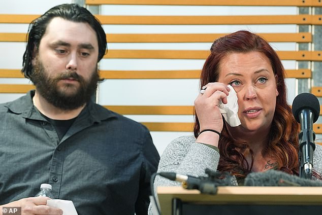 'How dare you fail my son in such a shockingly avoidable way?' Jessica Vestal (pictured with her husband Devon), mother of Dax, who was seen being brutally beaten in the school bus video, said as she wiped away tears.