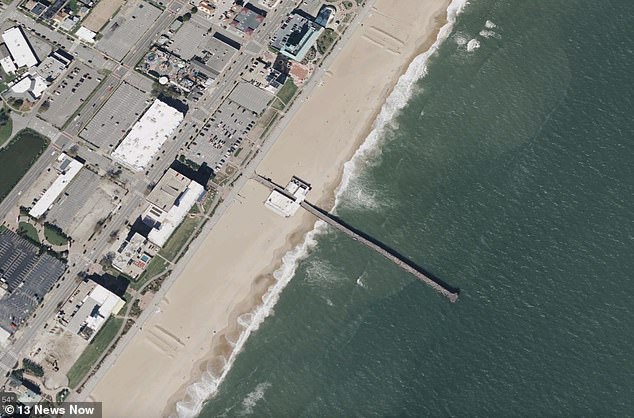 The driver roared down the 650-foot-long boardwalk and appeared to brake briefly before crashing into a wooden railing and tumbling into the ocean.