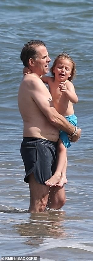 Hunter played the role of doting father this week while playing in the ocean with his son Beau Jr.