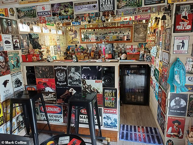 The interior of the shed has been designed as a pub and has more than 300 tin signs decorating the walls.