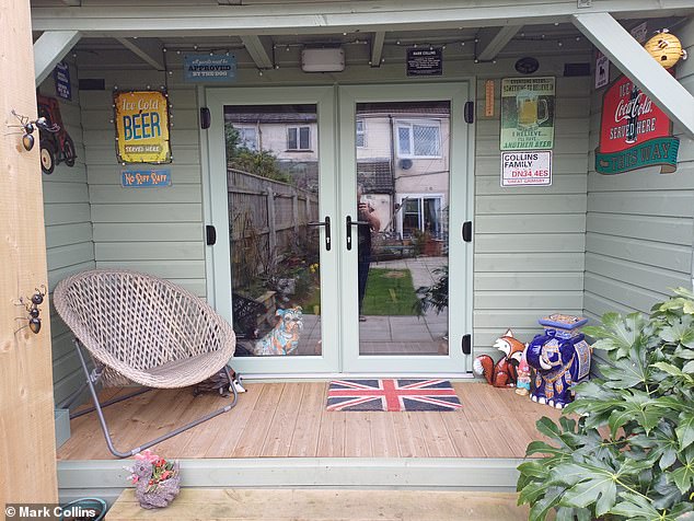 The colorful shed has an outside porch, with more of Mark's beloved tin signs on the walls.