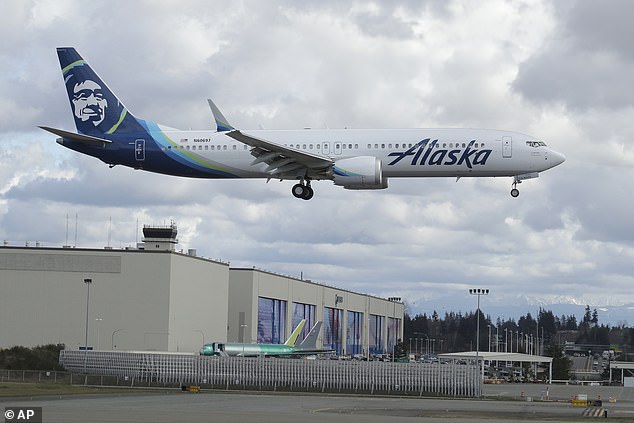 An Alaska Airlines Boeing 737-9 Max flies over the Boeing manufacturing facility in Everett, where Salehpour worked.