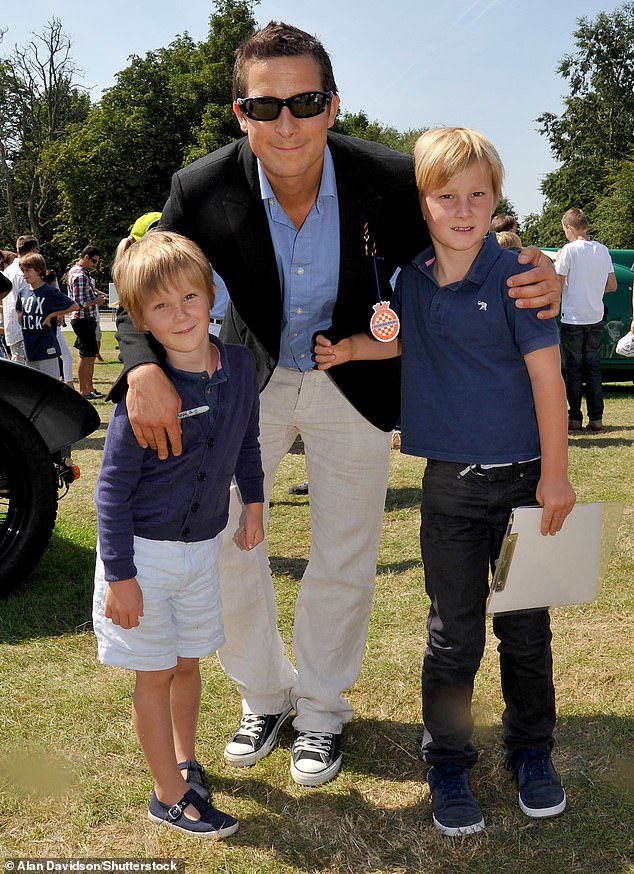 Bear is seen with his sons Jesse and Marmaduke at Goodwood House in July 2011.
