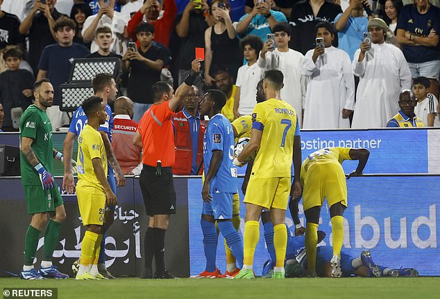Referee Mohammed Al-Hoaish shows Ronaldo a direct red card for violent conduct