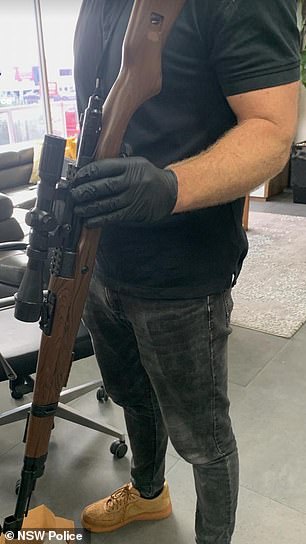 Detectives found a rifle in one of the raids.